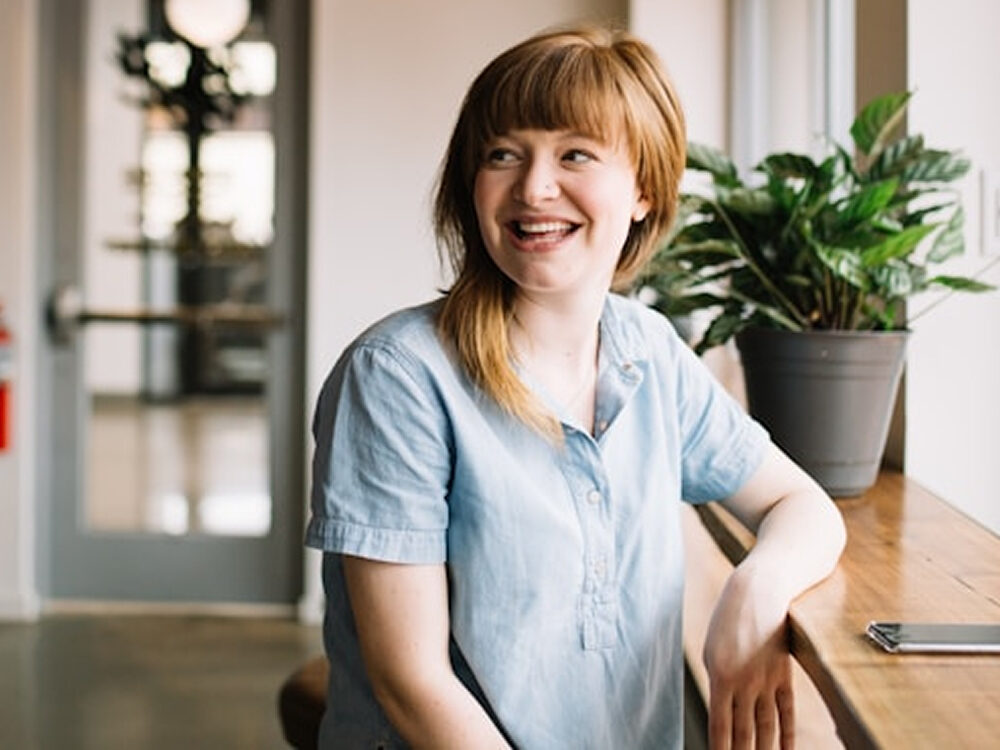 Lady sitting at desk smiling